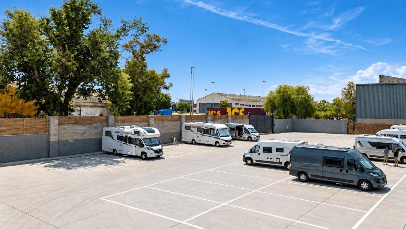 Motorhomes and a van parked on the site